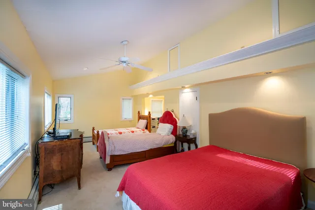 a view of a house with backyard fire pit and outdoor seating