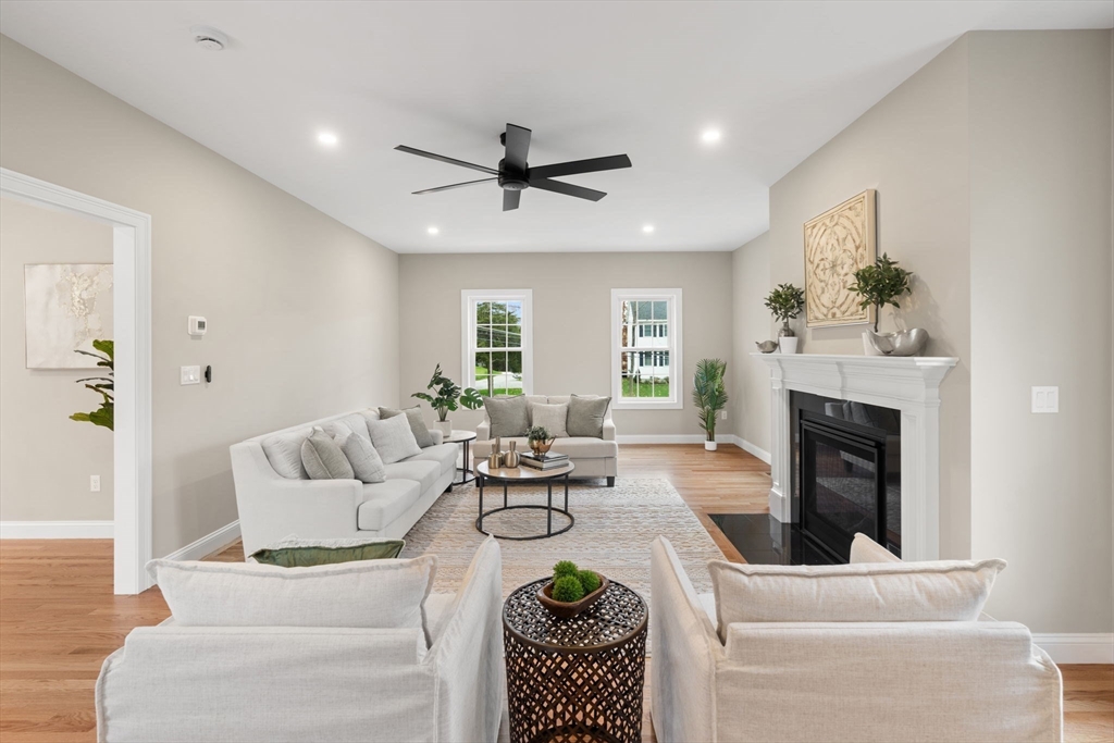 103 Central Street Andover, MA 01810 - Photo 18 of 42 a living room with furniture a fireplace and a window
