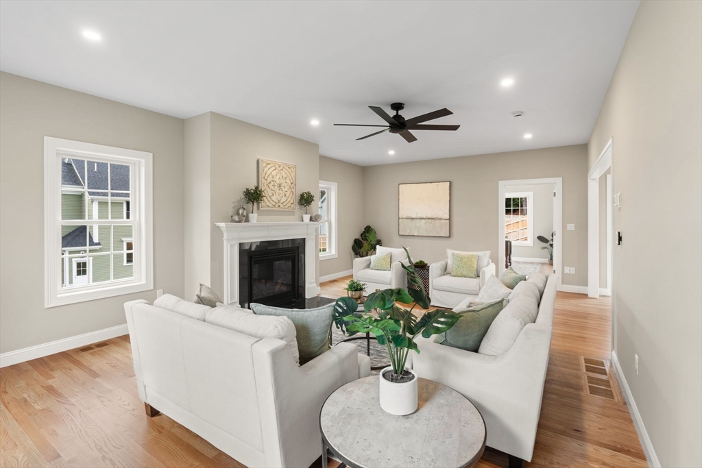 103 Central Street Andover, MA 01810 - Photo 19 of 42 a living room with furniture potted plant and a fireplace