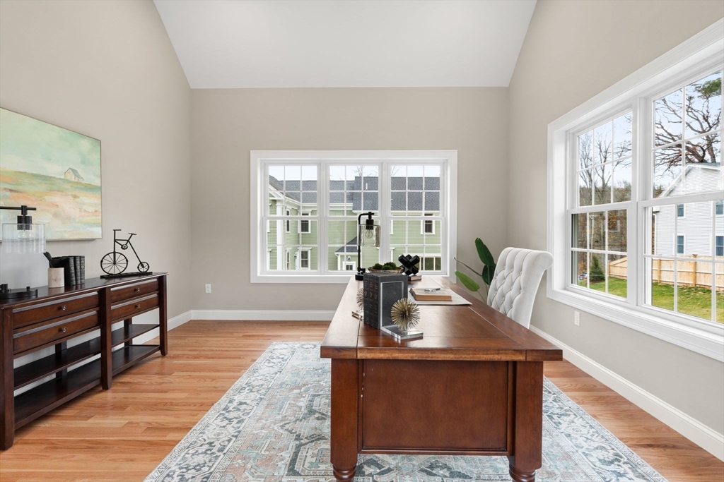 103 Central Street Andover, MA 01810 - Photo 22 of 42 a living room with furniture a large window and wooden floor