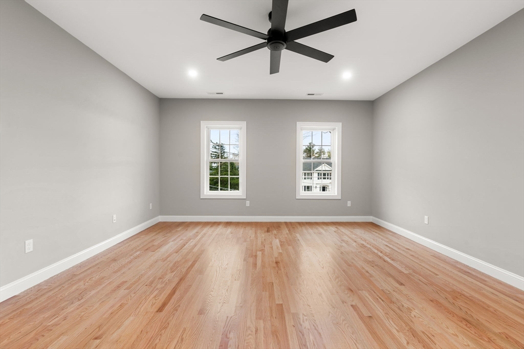 103 Central Street Andover, MA 01810 - Photo 28 of 42 wooden floor in an empty room with a window