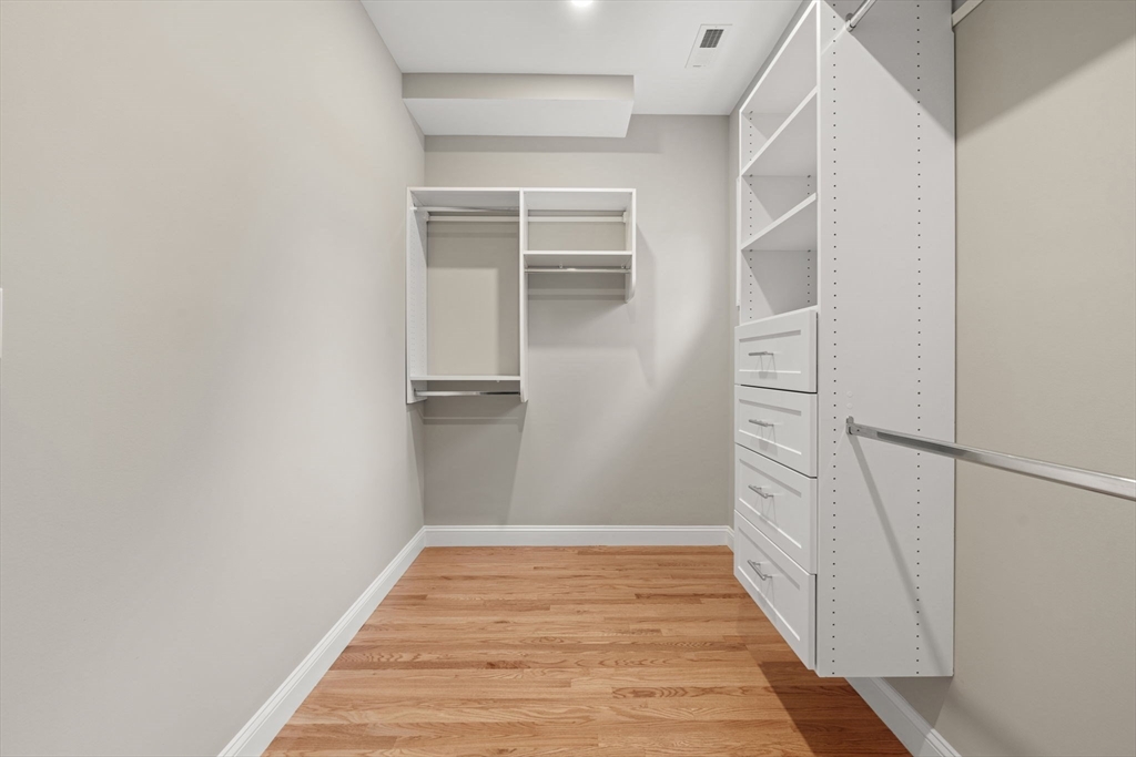 103 Central Street Andover, MA 01810 - Photo 29 of 42 a view of a hallway with wooden floor and entryway