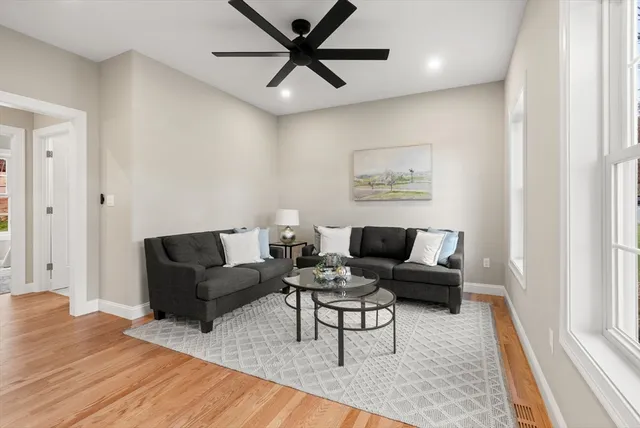 a living room with furniture and a rug