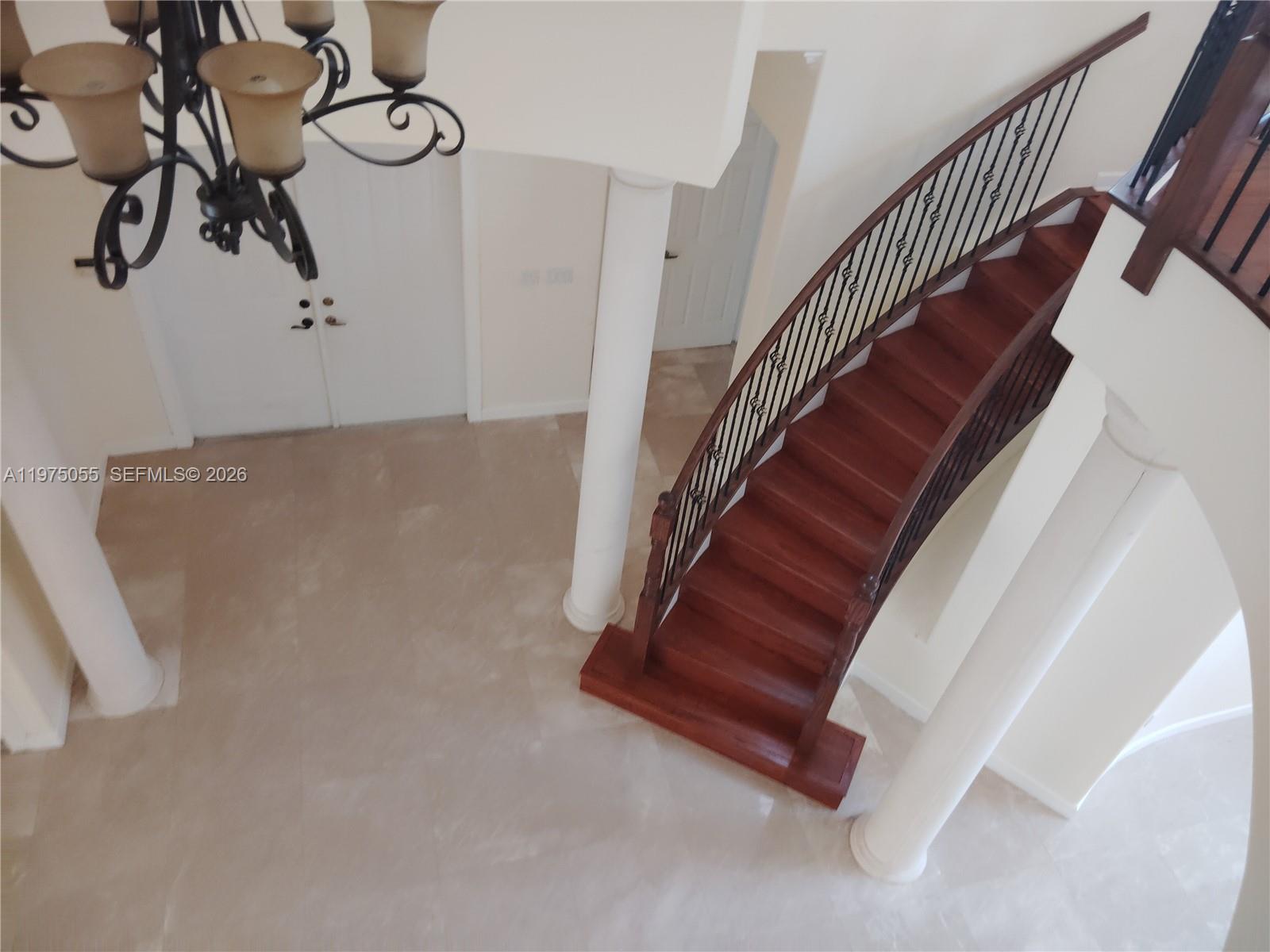 7944 Southwest 194th Street Cutler Bay, FL 33157 - Photo 9 of 10 a view of staircase with white walls and railing