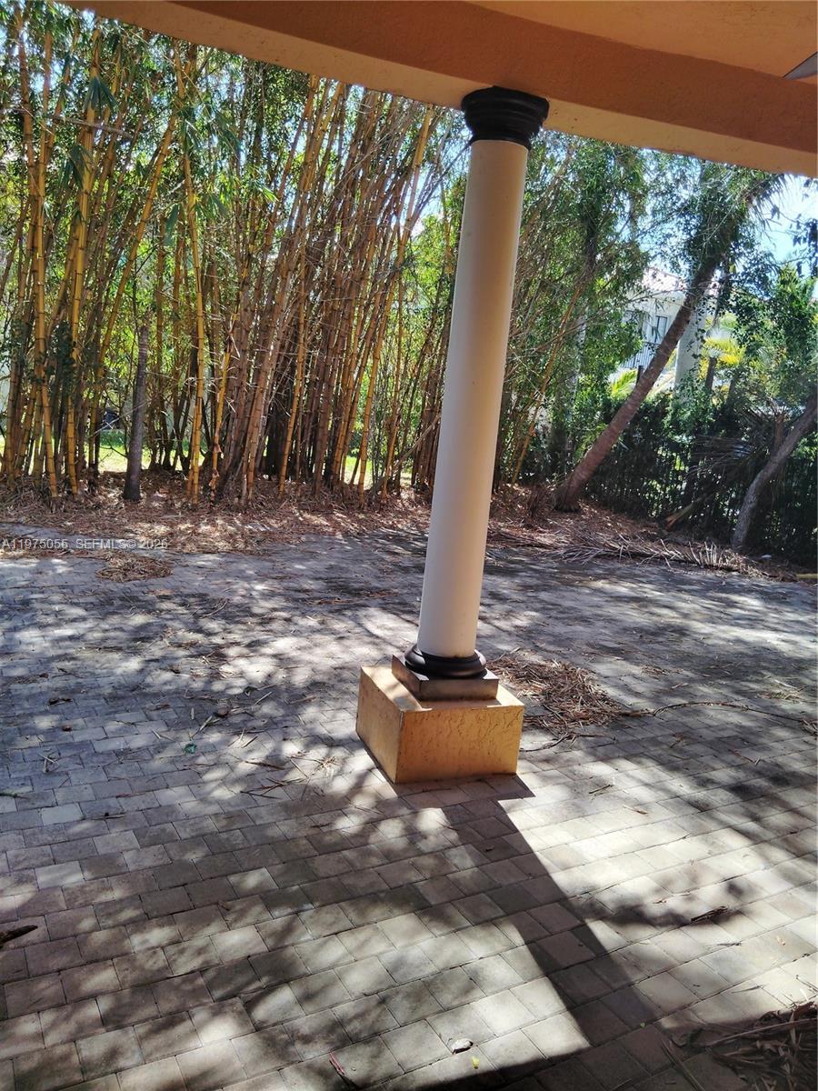 7944 Southwest 194th Street Cutler Bay, FL 33157 - Photo 10 of 10 a view of a porch with a tree