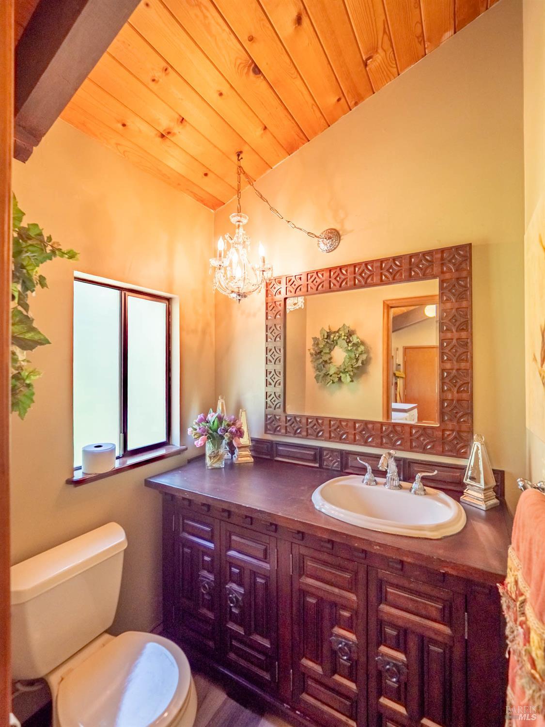 7701 Signal Ridge Road Philo, CA 95466 - Photo 12 of 32 The half bath sits just beyond the laundry on the street level.