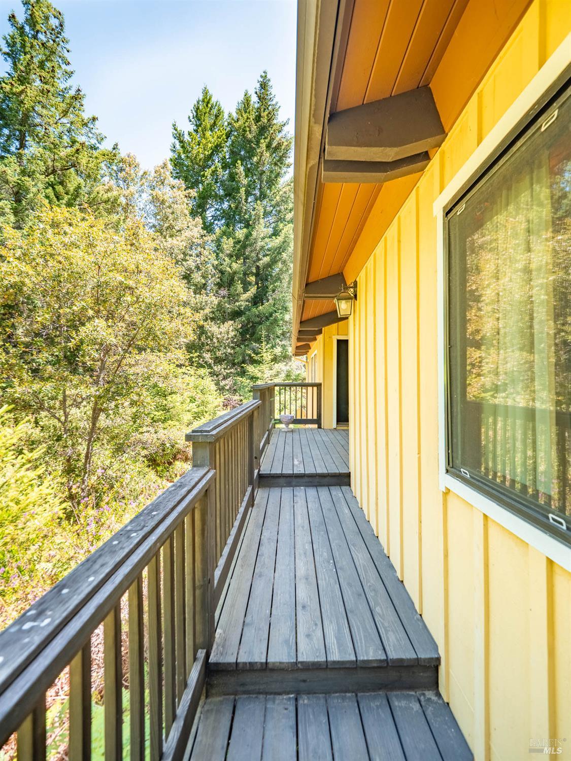 7701 Signal Ridge Road Philo, CA 95466 - Photo 21 of 32 This deck on the rear of the home leads to a covered back porch - prefect space for all weather outdoor enjoyment.