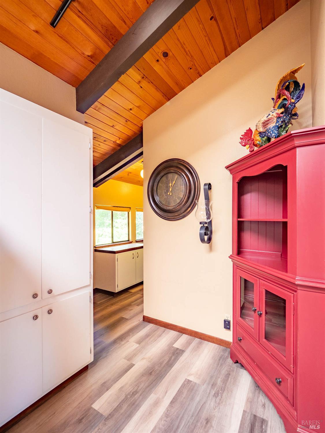 7701 Signal Ridge Road Philo, CA 95466 - Photo 10 of 32 This large pantry cabinet sits at the edge of the kitchen, in the hall leading to the laundry area.