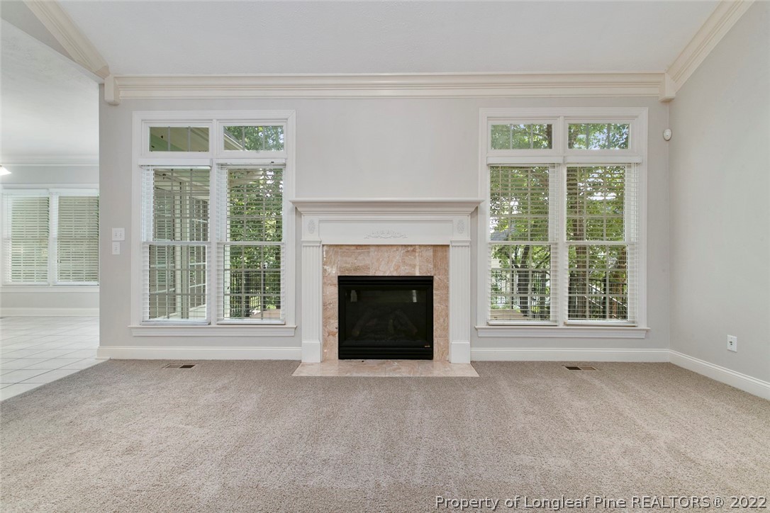 480 Whispering Pines Drive Spring Lake, NC 28390 - Photo 11 of 48 a view of a livingroom with a fireplace