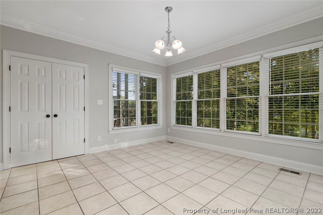 480 Whispering Pines Drive Spring Lake, NC 28390 - Photo 13 of 48 a view of an empty room with windows
