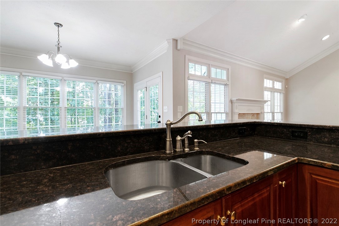 480 Whispering Pines Drive Spring Lake, NC 28390 - Photo 20 of 48 a kitchen with a sink and a window