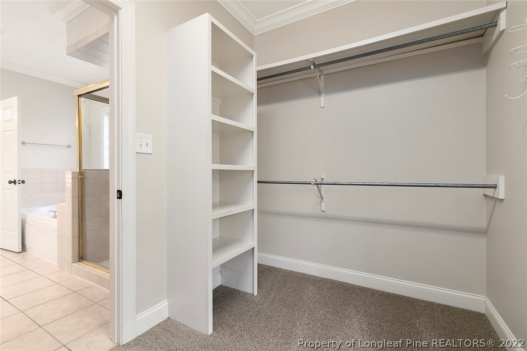 480 Whispering Pines Drive Spring Lake, NC 28390 - Photo 32 of 48 a view of an empty walk in closet and bedroom