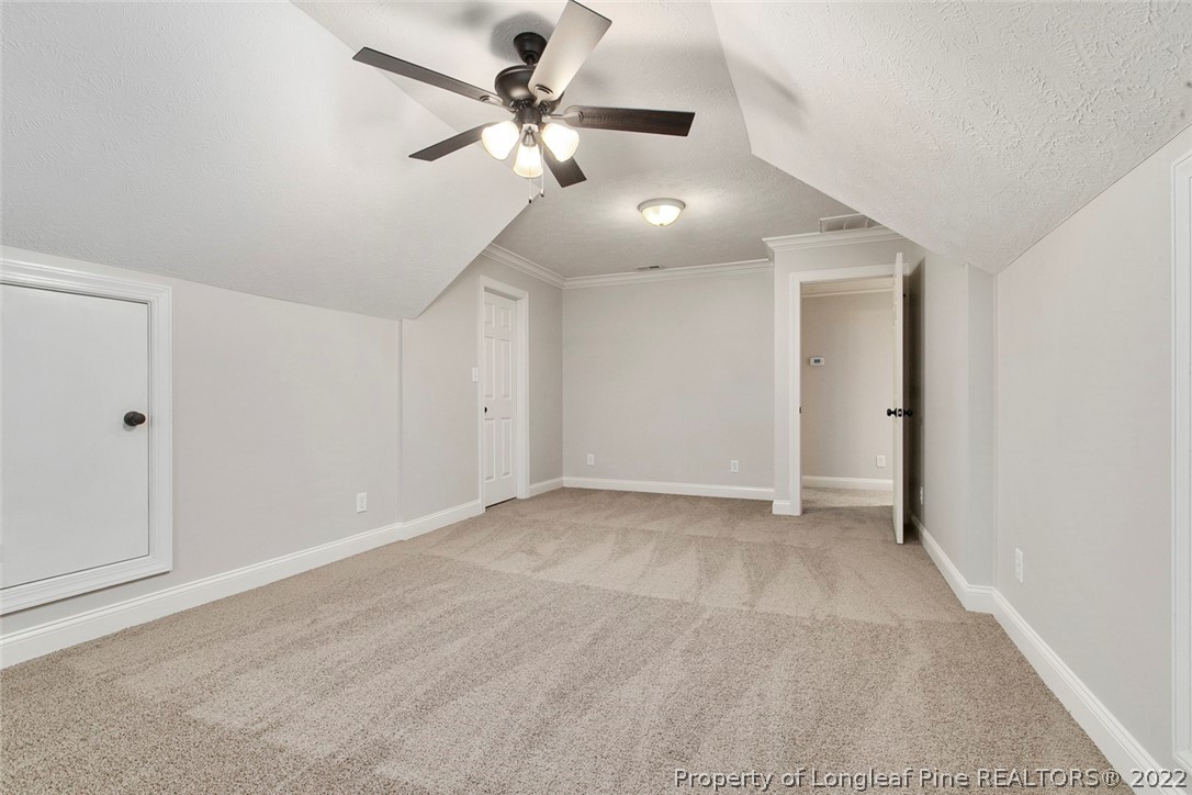 480 Whispering Pines Drive Spring Lake, NC 28390 - Photo 43 of 48 an empty room with fan and a ceiling fan