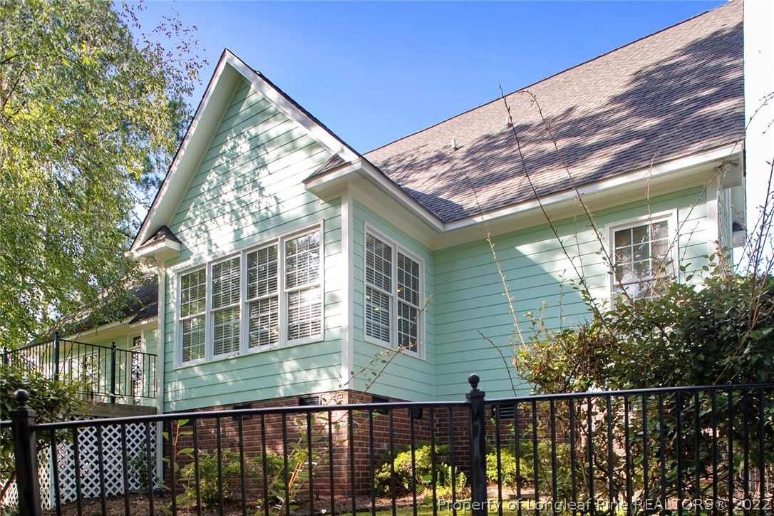 480 Whispering Pines Drive Spring Lake, NC 28390 - Photo 47 of 48 a view of a brick house with a large window