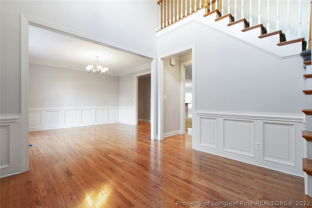 480 Whispering Pines Drive Spring Lake, NC 28390 - Photo 5 of 48 a view of an empty room with wooden floor
