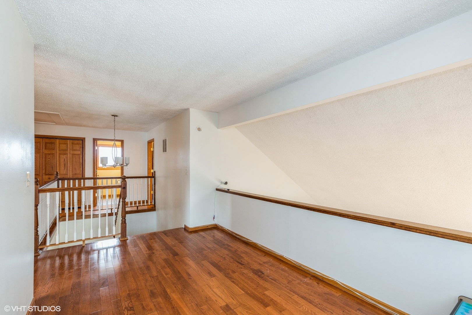 329 Killdeer Road Bloomingdale, IL 60108 - Photo 12 of 31 a view of a room with wooden floor and a window