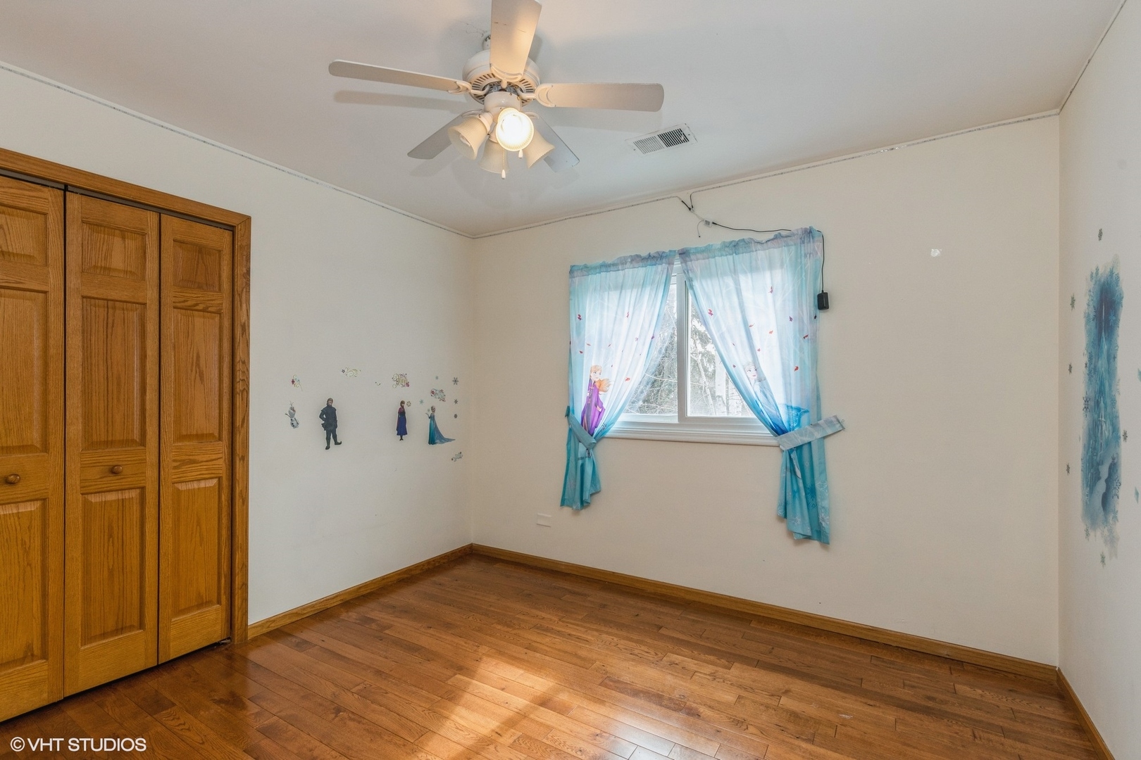 329 Killdeer Road Bloomingdale, IL 60108 - Photo 14 of 31 wooden floor in an empty room with a window