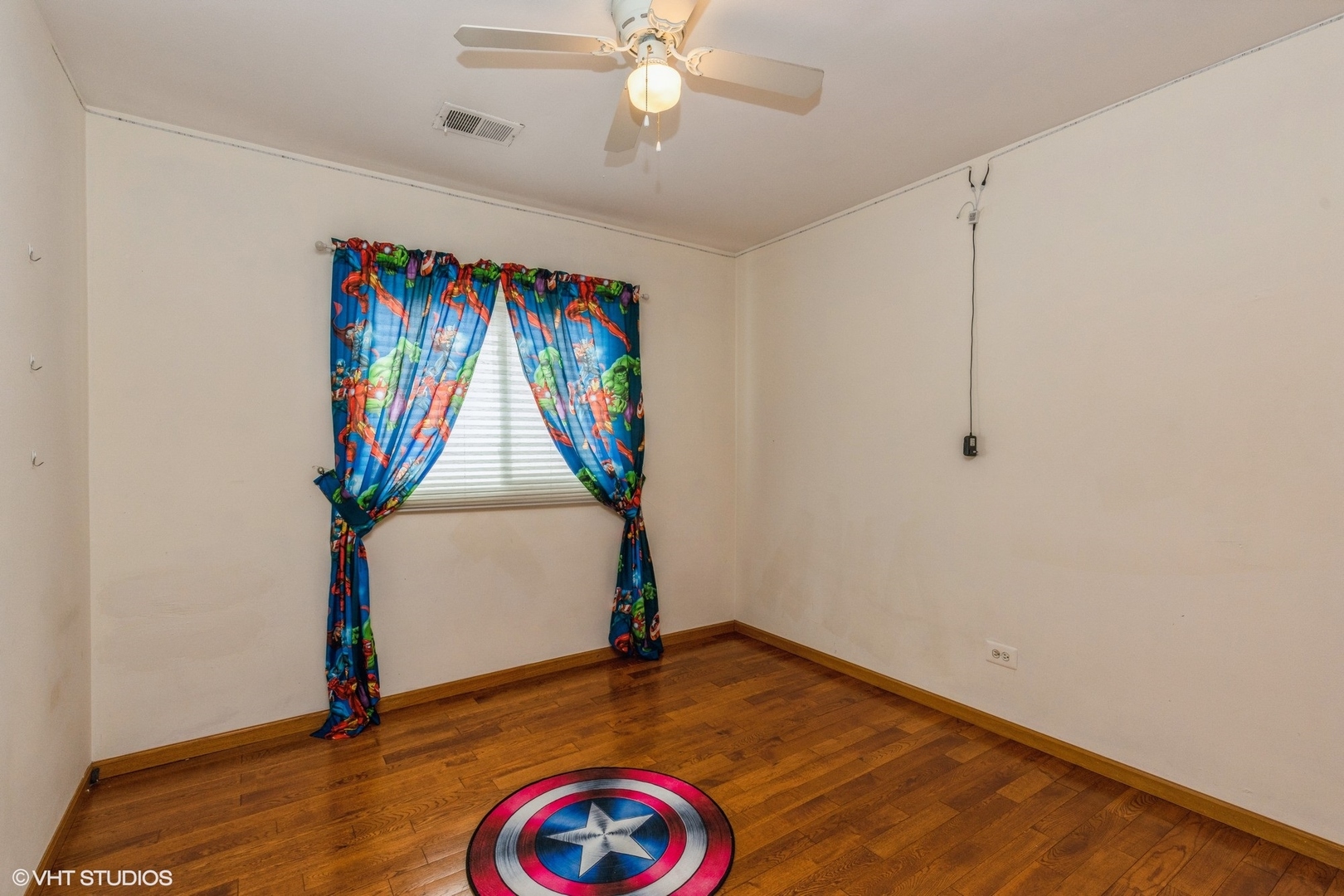 329 Killdeer Road Bloomingdale, IL 60108 - Photo 16 of 31 an empty room with wooden floor and ceiling fan