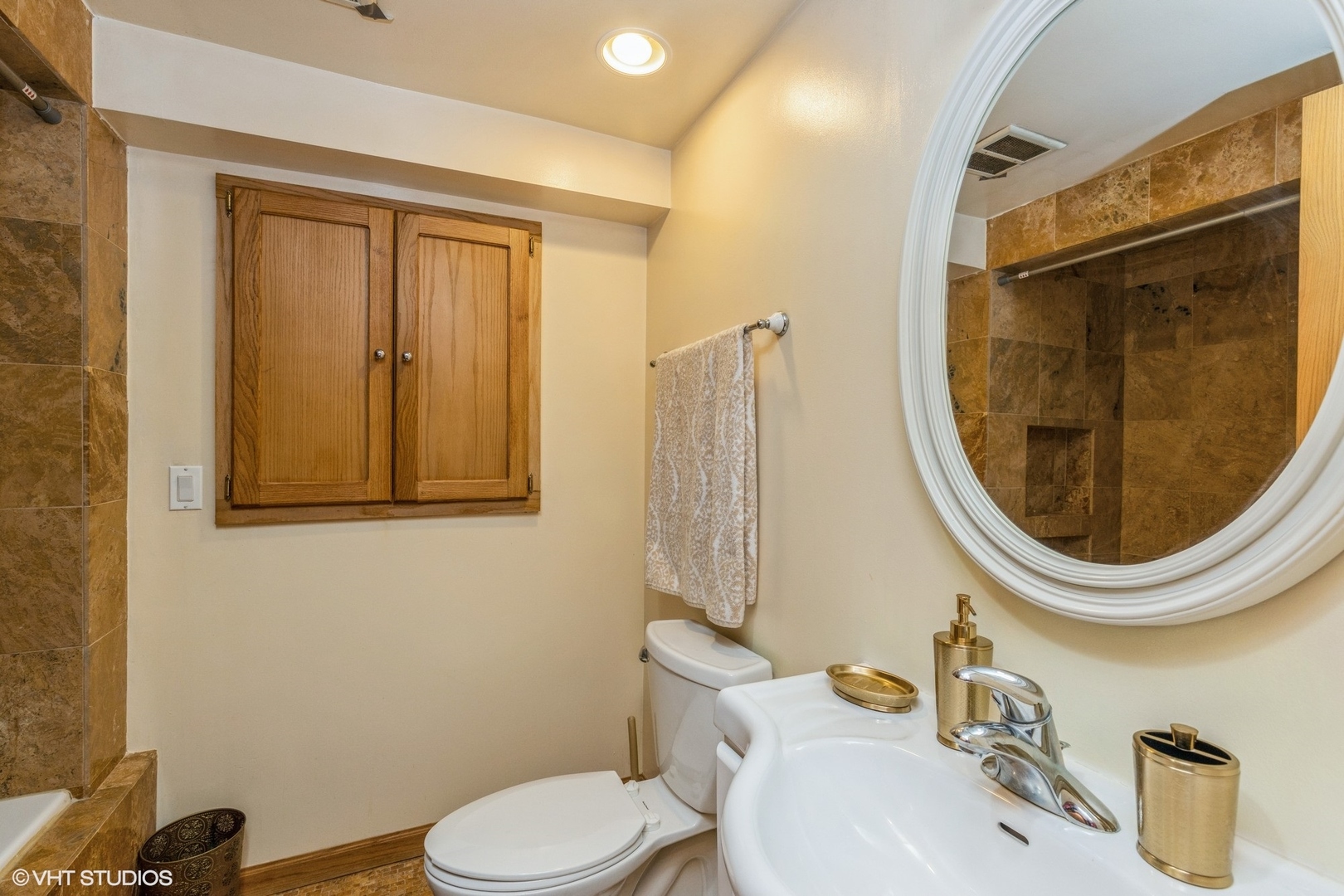329 Killdeer Road Bloomingdale, IL 60108 - Photo 23 of 31 a bathroom with a sink a toilet and a mirror