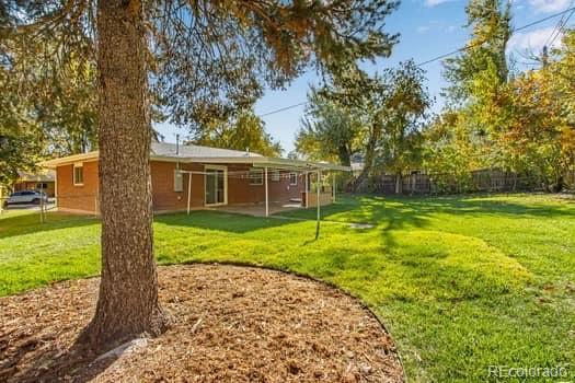 355 32nd Street Boulder, CO 80305 - Photo 13 of 14 a view of a house with a yard