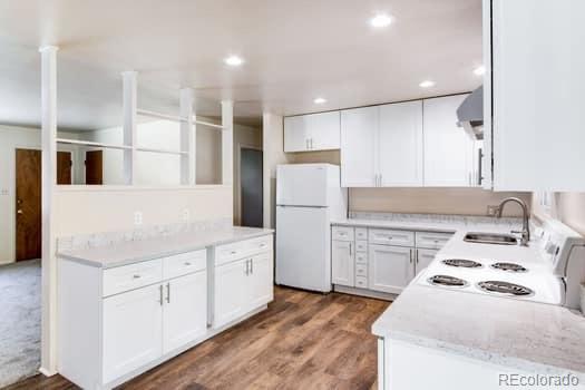 355 32nd Street Boulder, CO 80305 - Photo 4 of 14 a kitchen with white cabinets and refrigerator