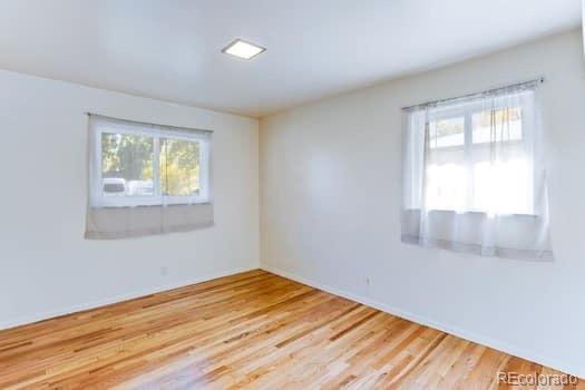 355 32nd Street Boulder, CO 80305 - Photo 5 of 14 a view of empty room with wooden floor and fan