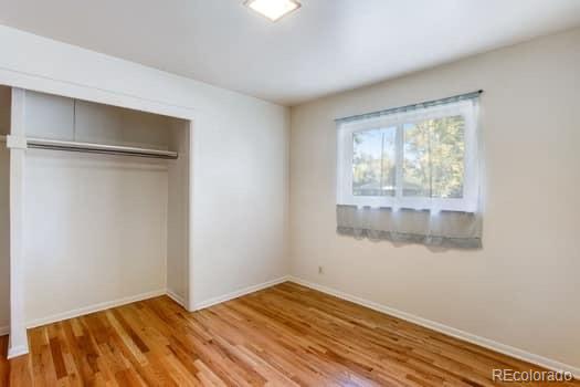 355 32nd Street Boulder, CO 80305 - Photo 6 of 14 a view of empty room with wooden floor and fan