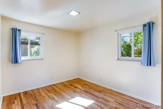 355 32nd Street Boulder, CO 80305 - Photo 8 of 14 a view of empty room with wooden floor and fan