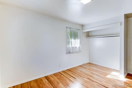 355 32nd Street Boulder, CO 80305 - Photo 9 of 14 a view of empty room with wooden floor and fan