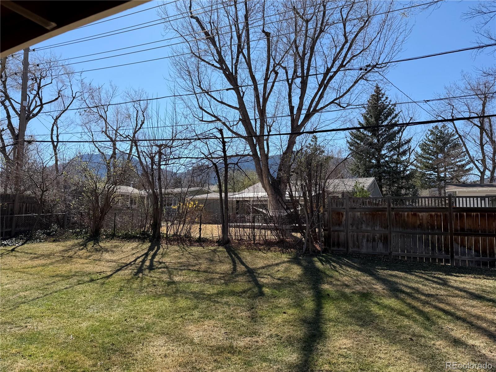 355 32nd Street Boulder, CO 80305 - Photo 10 of 14 a view of backyard with wooden fence
