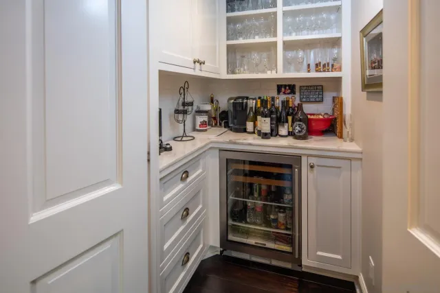 a kitchen with stainless steel appliances granite countertop a refrigerator and cabinets