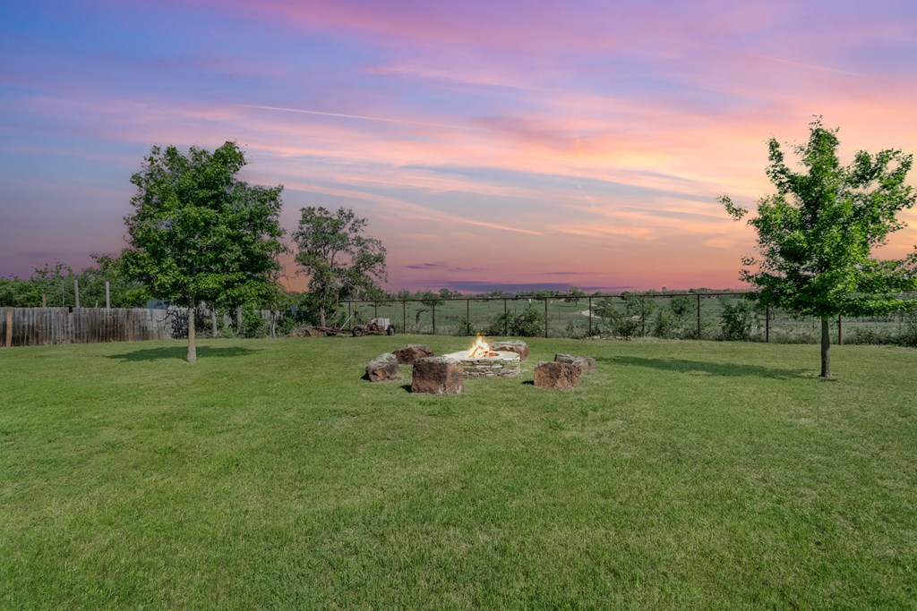 90 Quail Run Harper, TX 78631 - Photo 16 of 25 a view of a green field with trees