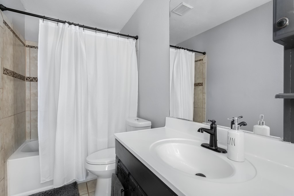 90 Quail Run Harper, TX 78631 - Photo 19 of 25 a bathroom with a sink toilet and shower