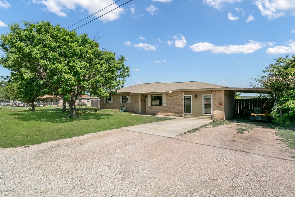 90 Quail Run Harper, TX 78631 - Photo 21 of 25 a front view of house with yard and green space