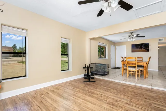 a view of a livingroom with furniture and a flat screen tv