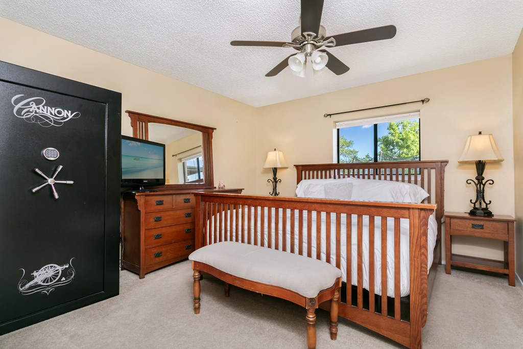 90 Quail Run Harper, TX 78631 - Photo 8 of 25 a bedroom with a bed and a tv