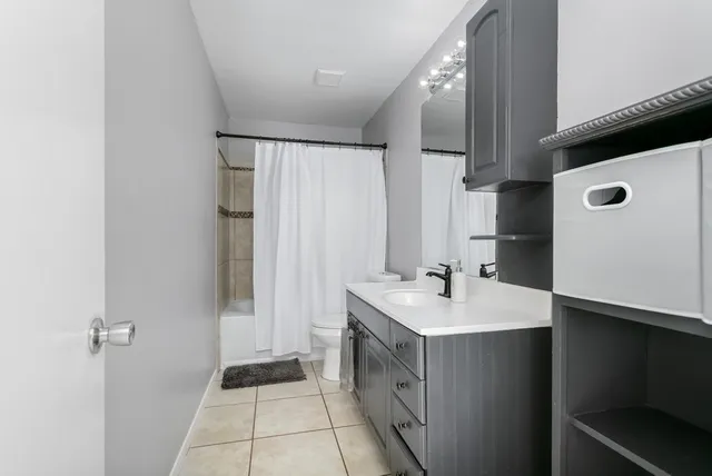 a bathroom with a sink a mirror and a toilet