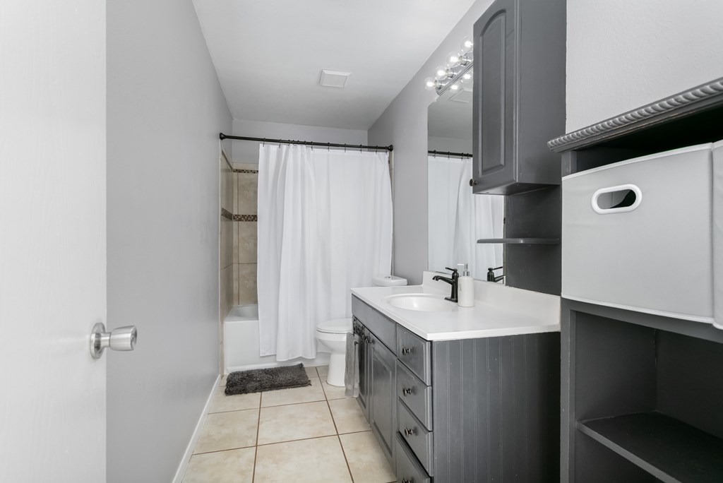 90 Quail Run Harper, TX 78631 - Photo 9 of 25 a bathroom with a sink a mirror and a toilet