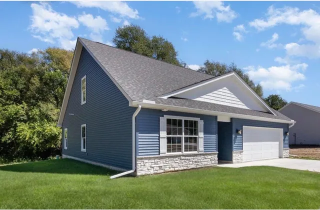 a view of front of house with a yard