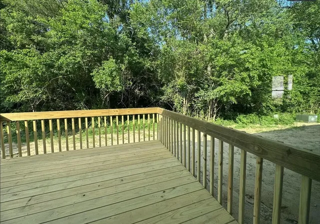 a view of a wooden roof deck