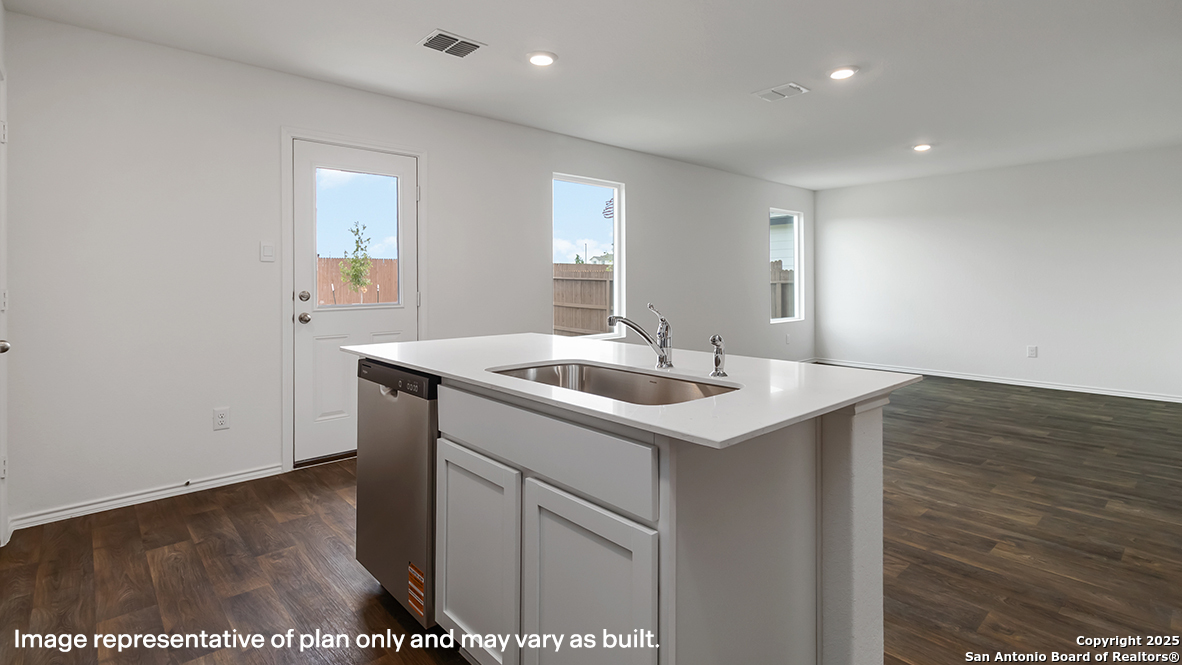 5019 Gecko Converse, TX 78109 - Photo 12 of 50 a kitchen with a sink cabinets and wooden floor