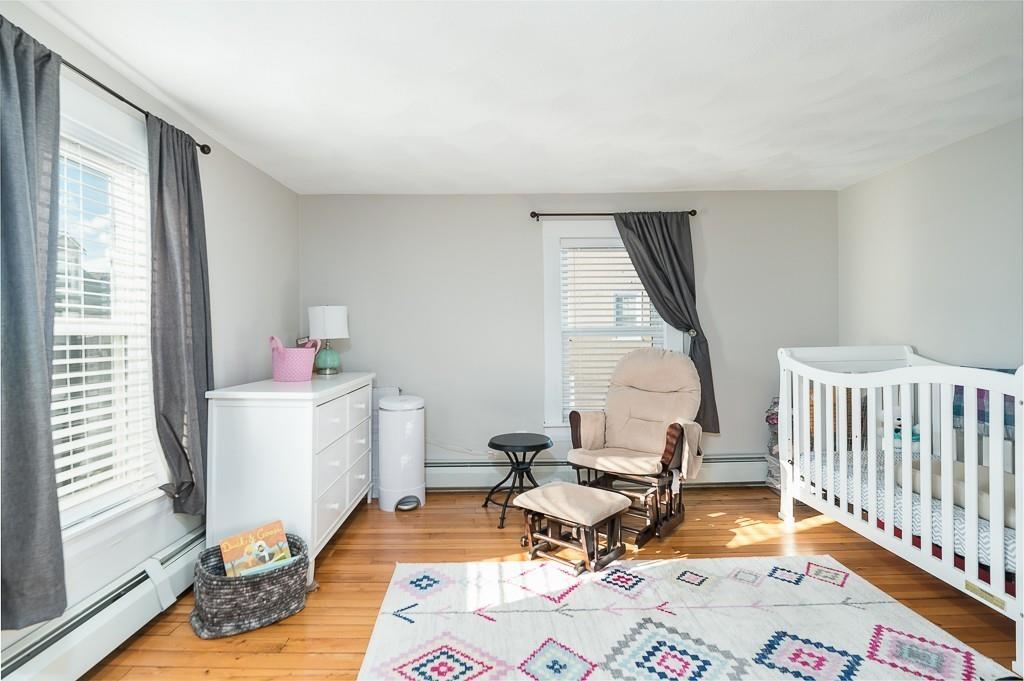 16 Bartlett Street Beverly, MA 01915 - Photo 19 of 28 a room with furniture a rug potted plant and a window