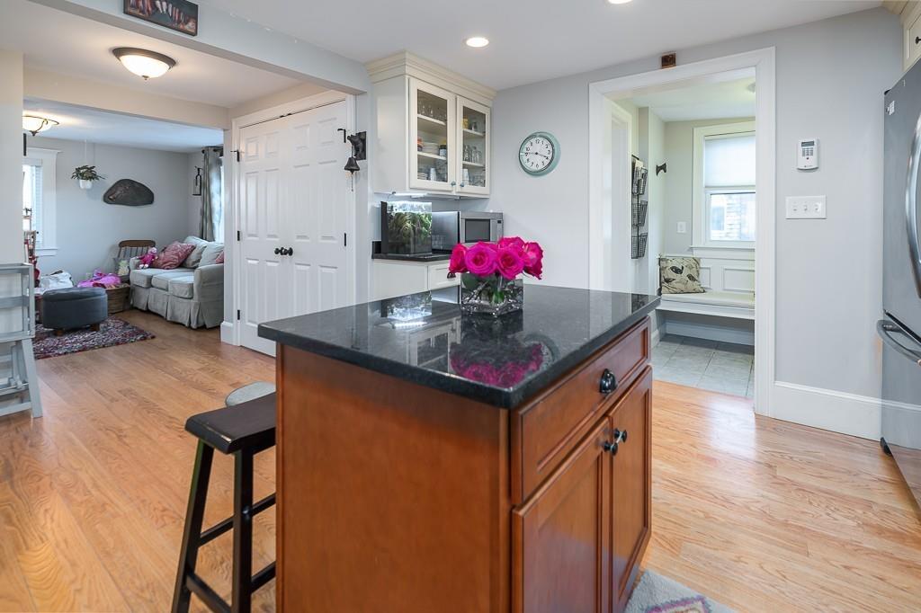 16 Bartlett Street Beverly, MA 01915 - Photo 4 of 28 a room with furniture and wooden floor