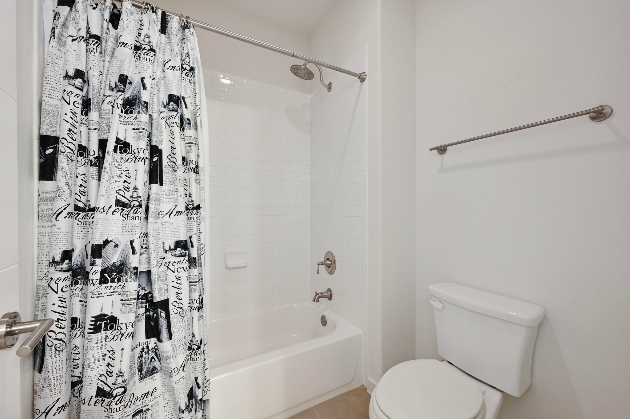 8901 Parker Ranch Circle, Unit A Austin, TX 78748 - Photo 26 of 31 A crisp white subway tile surround frames the classic soaking tub shower combination.