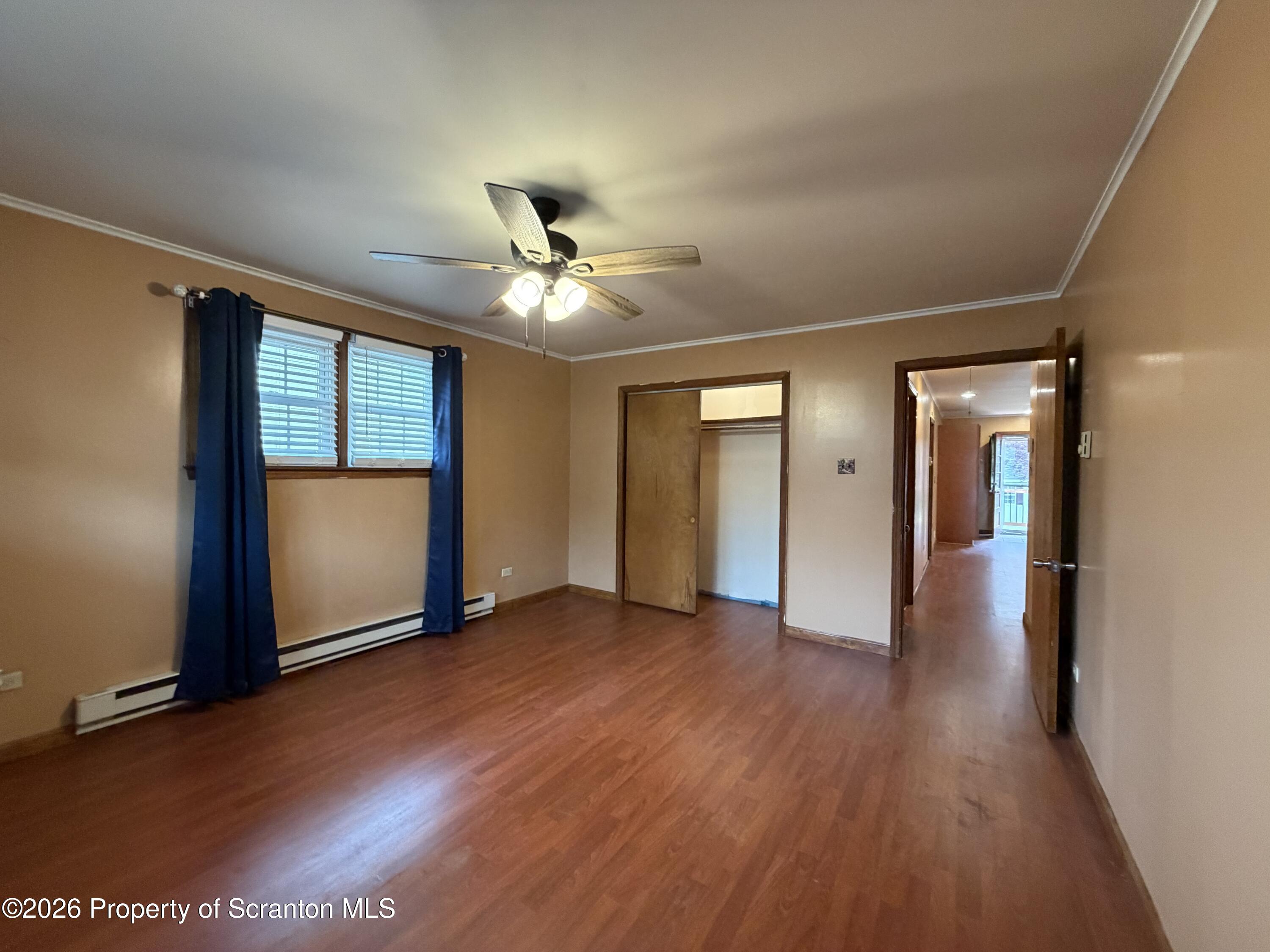 1019 Moosic Street Scranton, PA 18505 - Photo 25 of 43 an empty room with wooden floor and windows