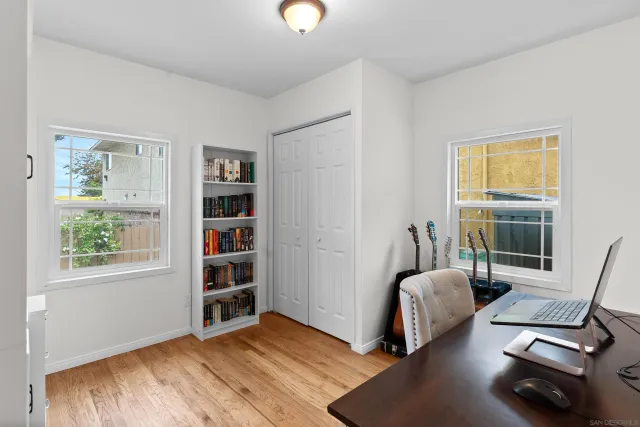 a view of a backyard with a tree