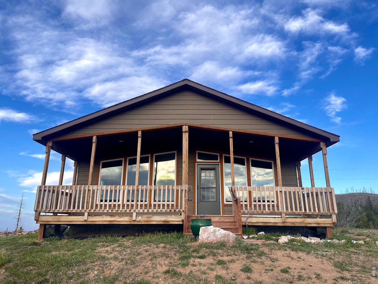 892 Stratton Park Road Bellvue, CO 80512 - Photo 8 of 27 a view of a house with a balcony deck