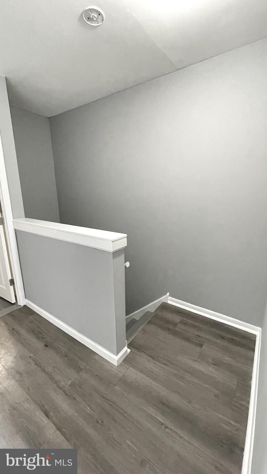 1340 West 7th Street Chester, PA 19013 - Photo 12 of 26 an empty room with wooden floor