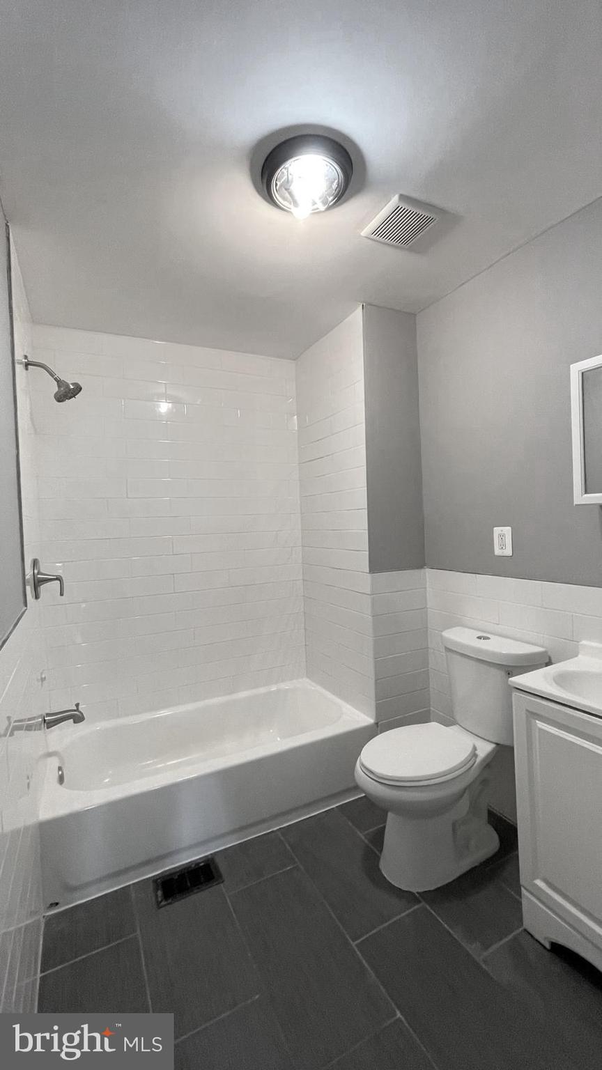 1340 West 7th Street Chester, PA 19013 - Photo 14 of 26 a bathroom with a sink a toilet and shower