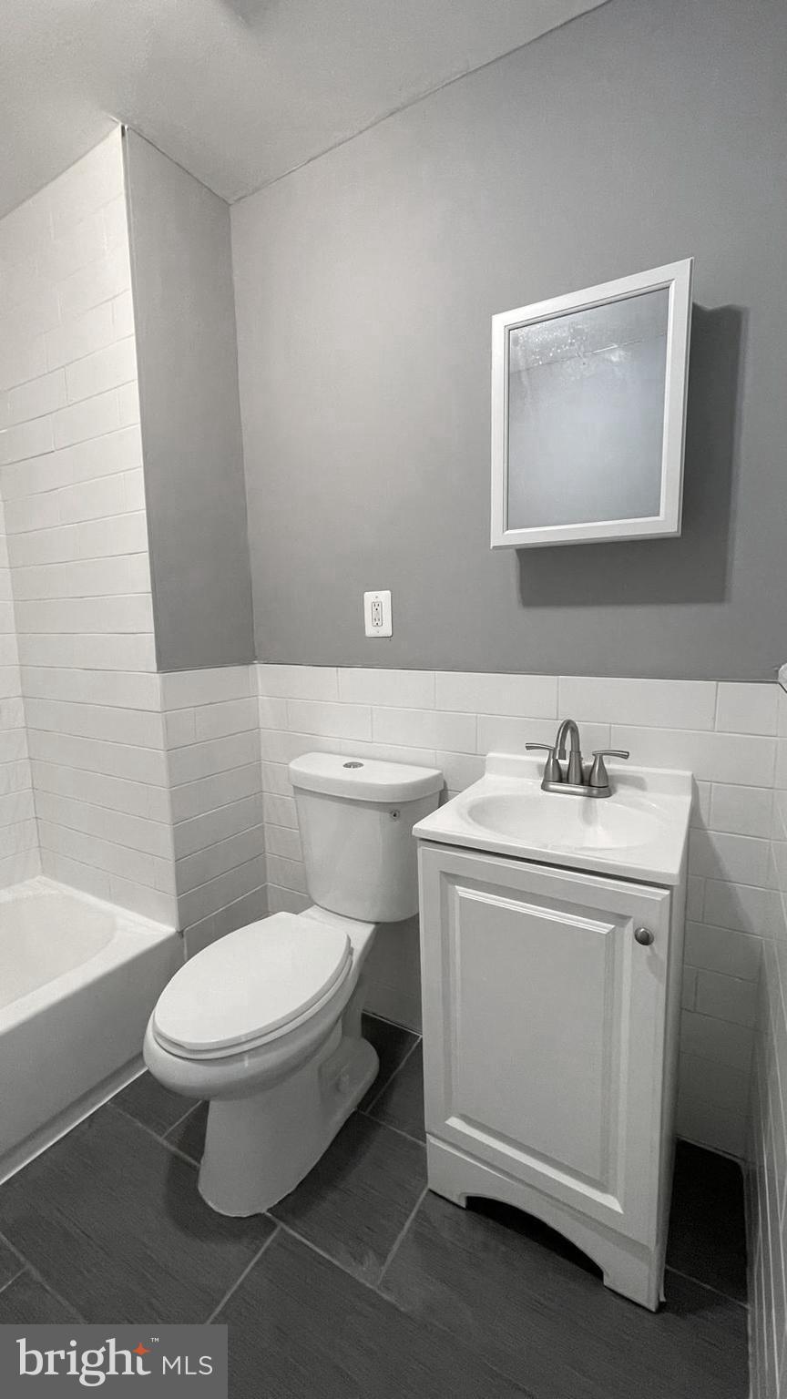 1340 West 7th Street Chester, PA 19013 - Photo 16 of 26 a bathroom with a sink toilet and shower